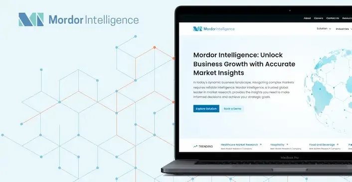The redesigned Mordor Intelligence homepage shown on a laptop