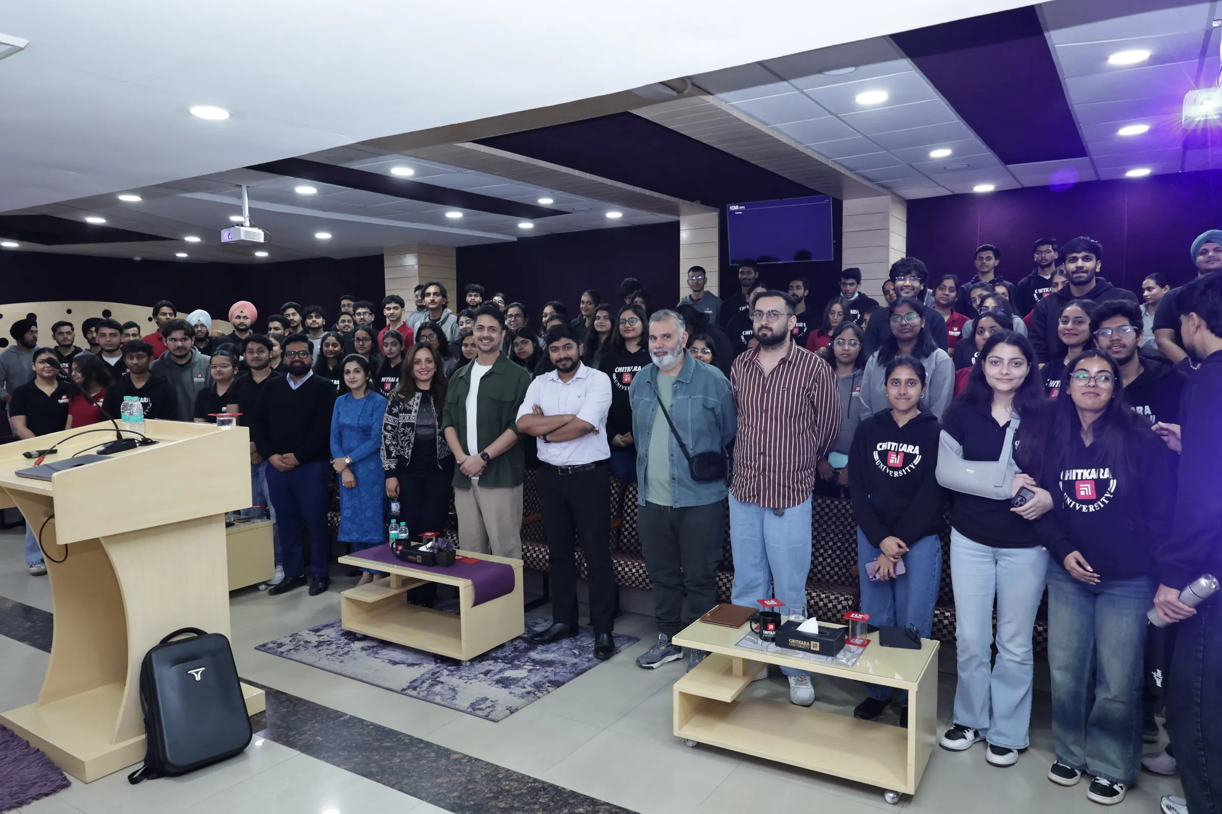 Ameet in a large group photo with attendees after the master class